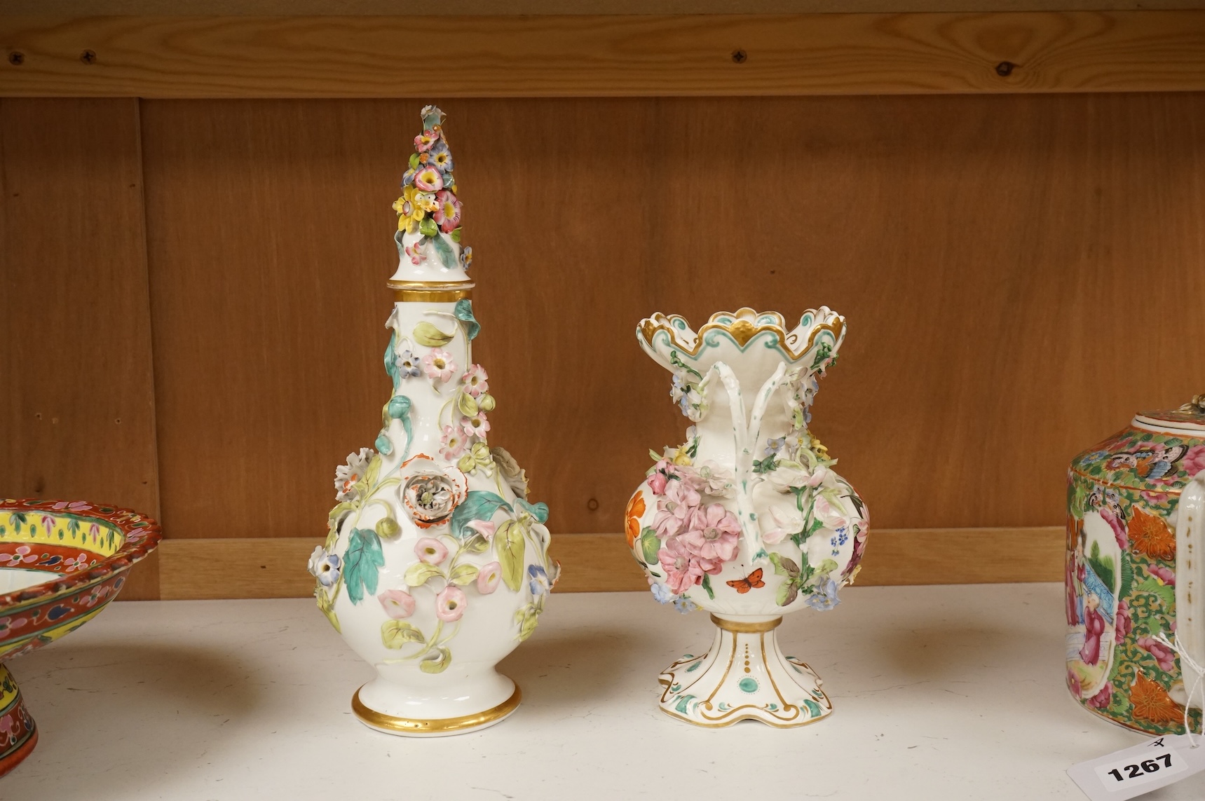 An English porcelain flower encrusted scent bottle and stoppers and a similar vase, c.1835, tallest 28cm